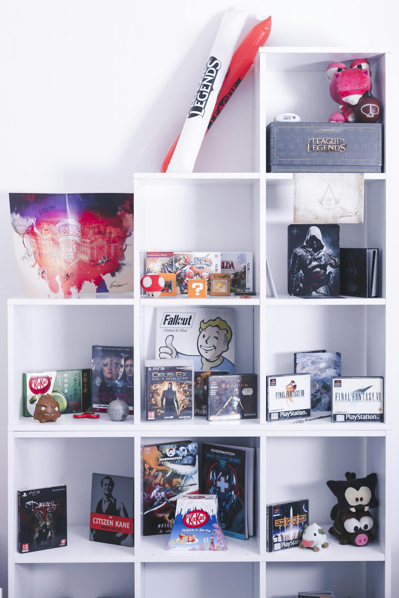 Colorful display of gaming and movie merchandise on a white shelf, perfect for fans and collectors.